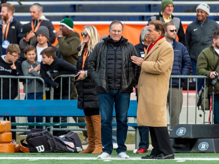 Jan 22, 2020; Mobile, Alabama, USA; Alabama head coach Nick Saban at right talks with New England Patriots head coach Bill Belichick during Senior Bowl practice at Ladd-Peebles Stadium.